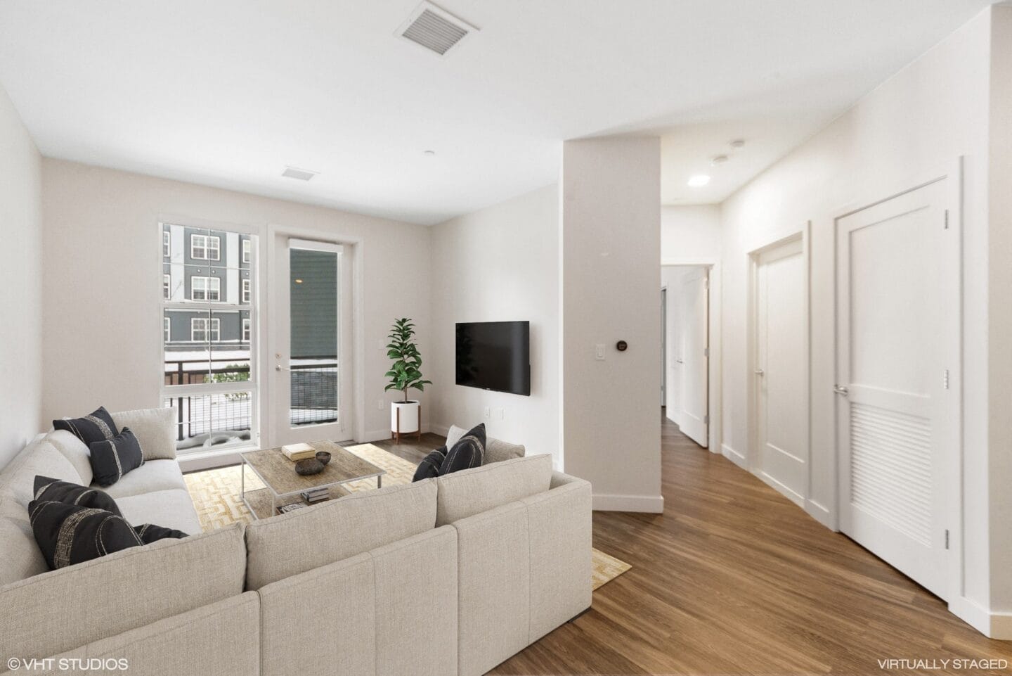 Living area with balcony at Edison in the Charles by Windsor, Massachusetts..