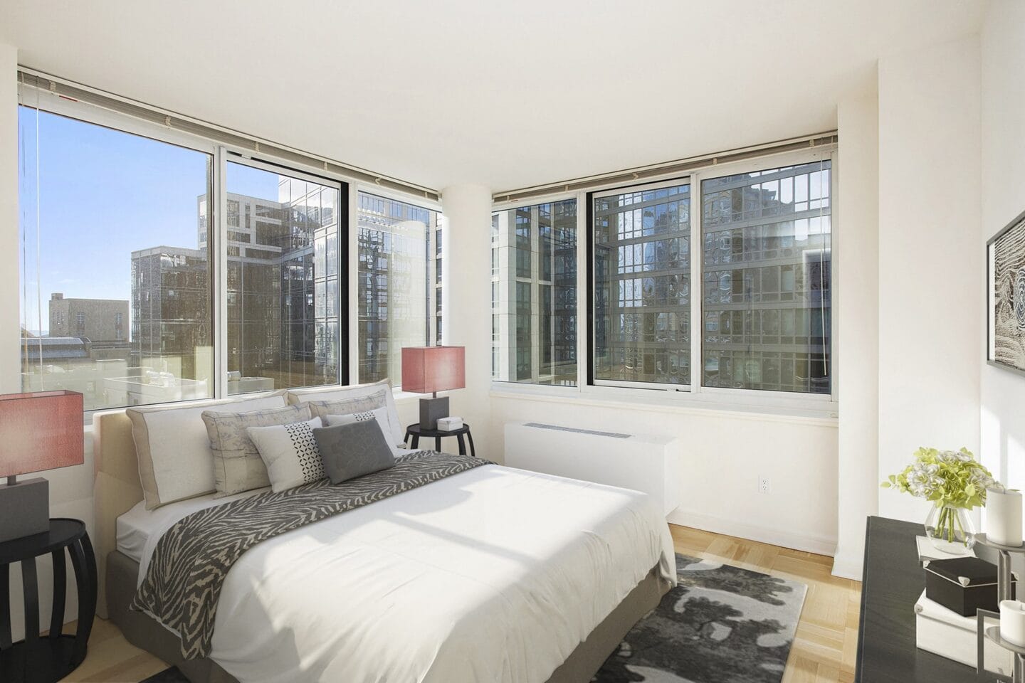 Bedroom with large windows at The Ashley Apartments, New York, New York