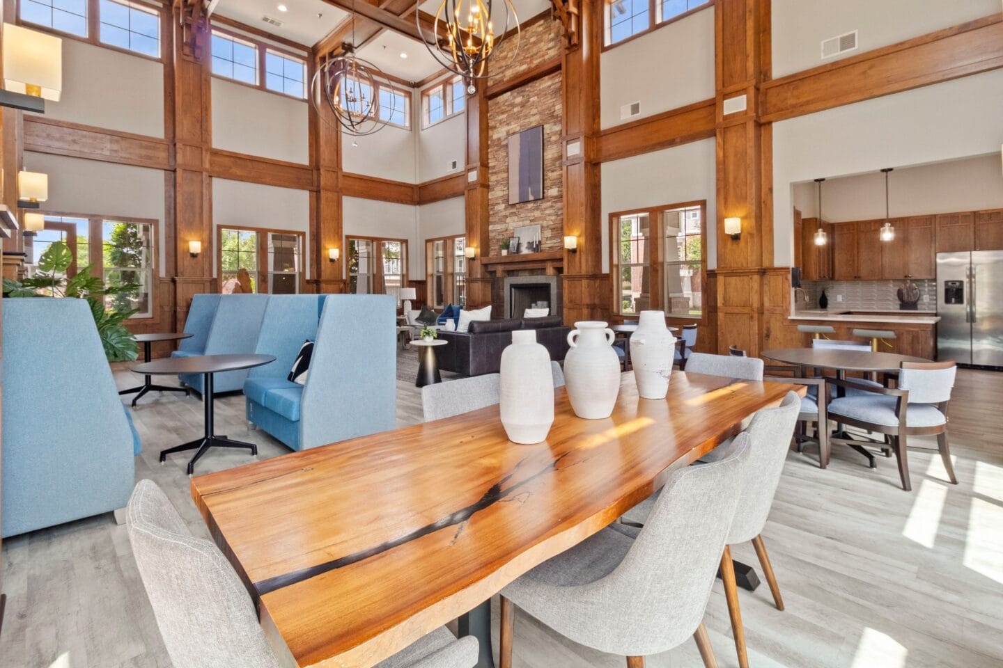 a large dining room with a wooden table and chairs