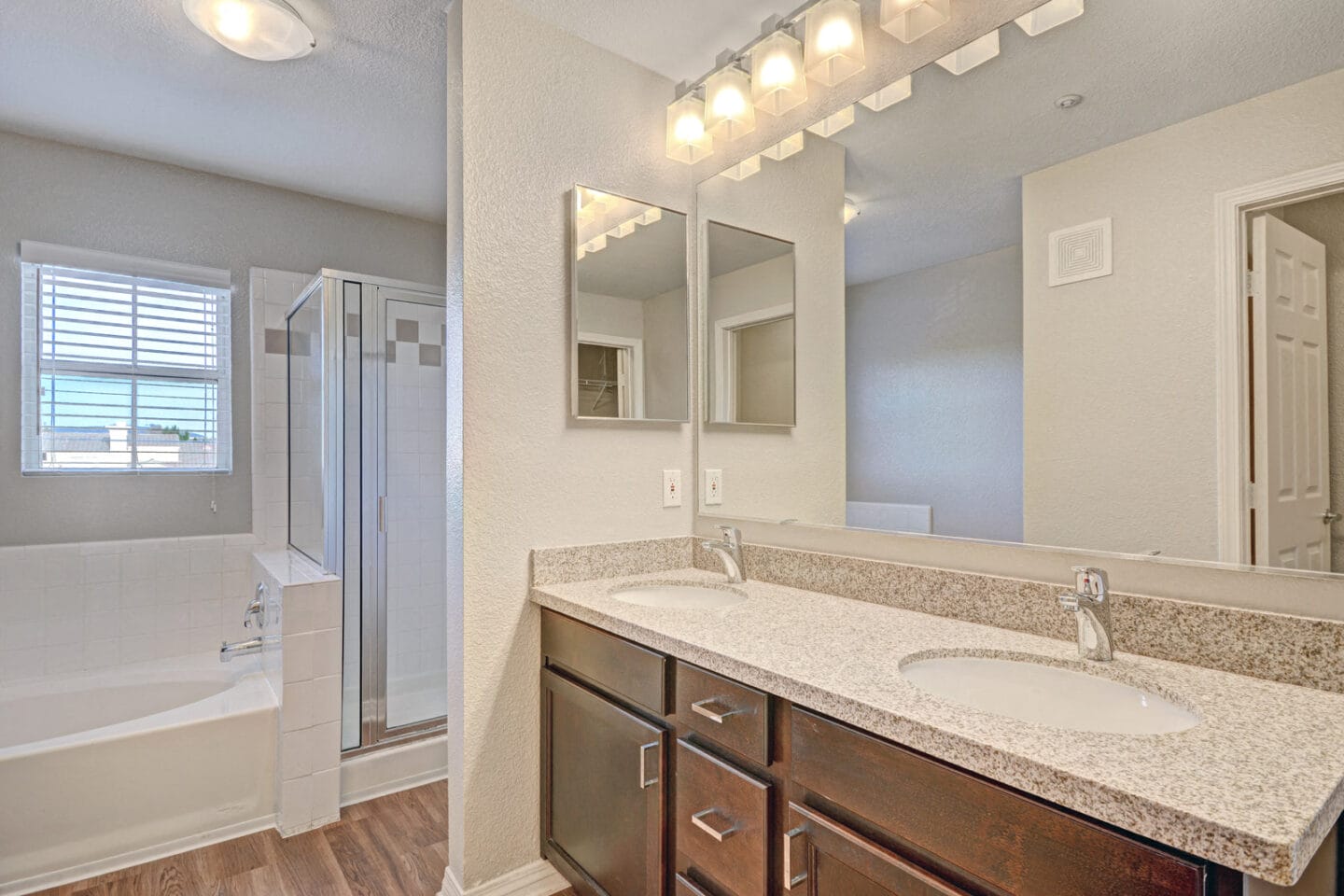 Quartz or Granite Counters and Custom Cabinetry in Bathrooms at Windsor at Aviara, Carlsbad, California