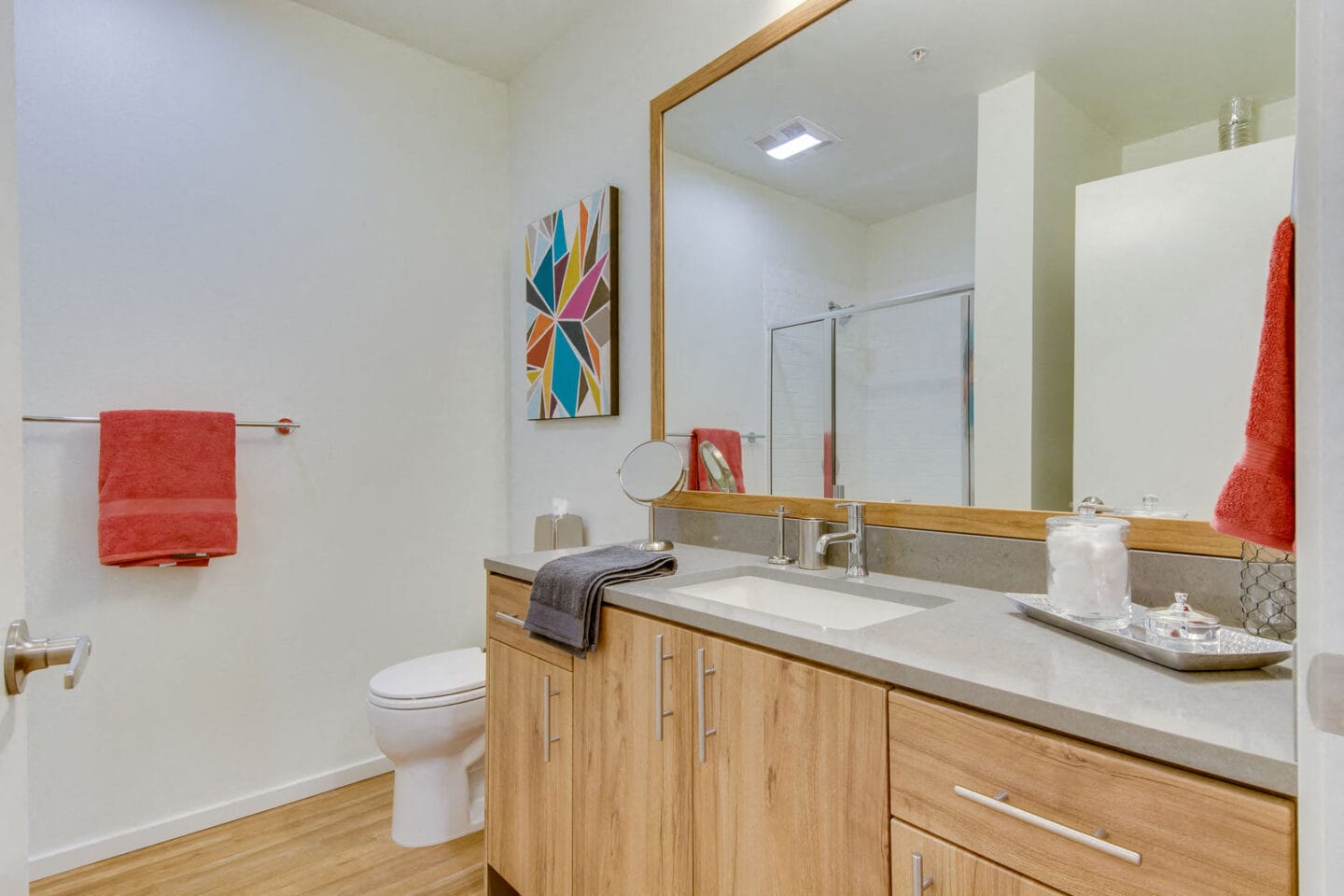 Bright Bathrooms with Vanity Storage at The Whittaker, 4755 Fauntleroy Way, Seattle