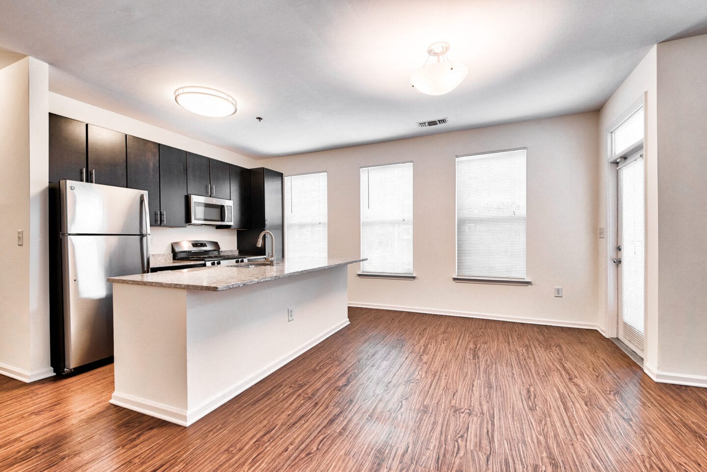 Open layouts with black walnut vinyl flooring at Windsor at Liberty House, 115 Morris Street, Jersey City