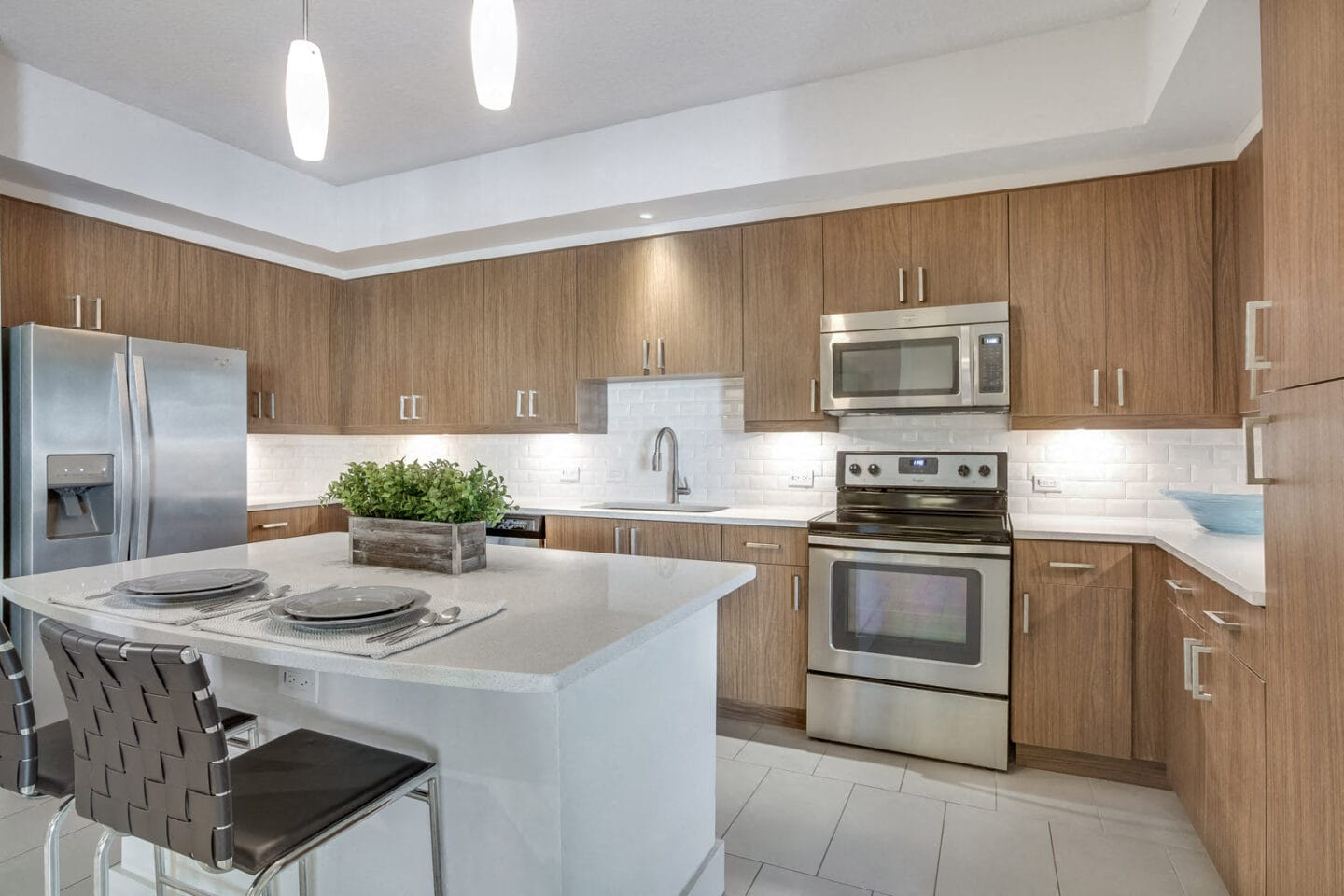 Chef-Inspired Kitchens with Quartz Counters and Stainless Steel Appliances at Windsor at Doral, 4401 NW 87th Avenue, Doral