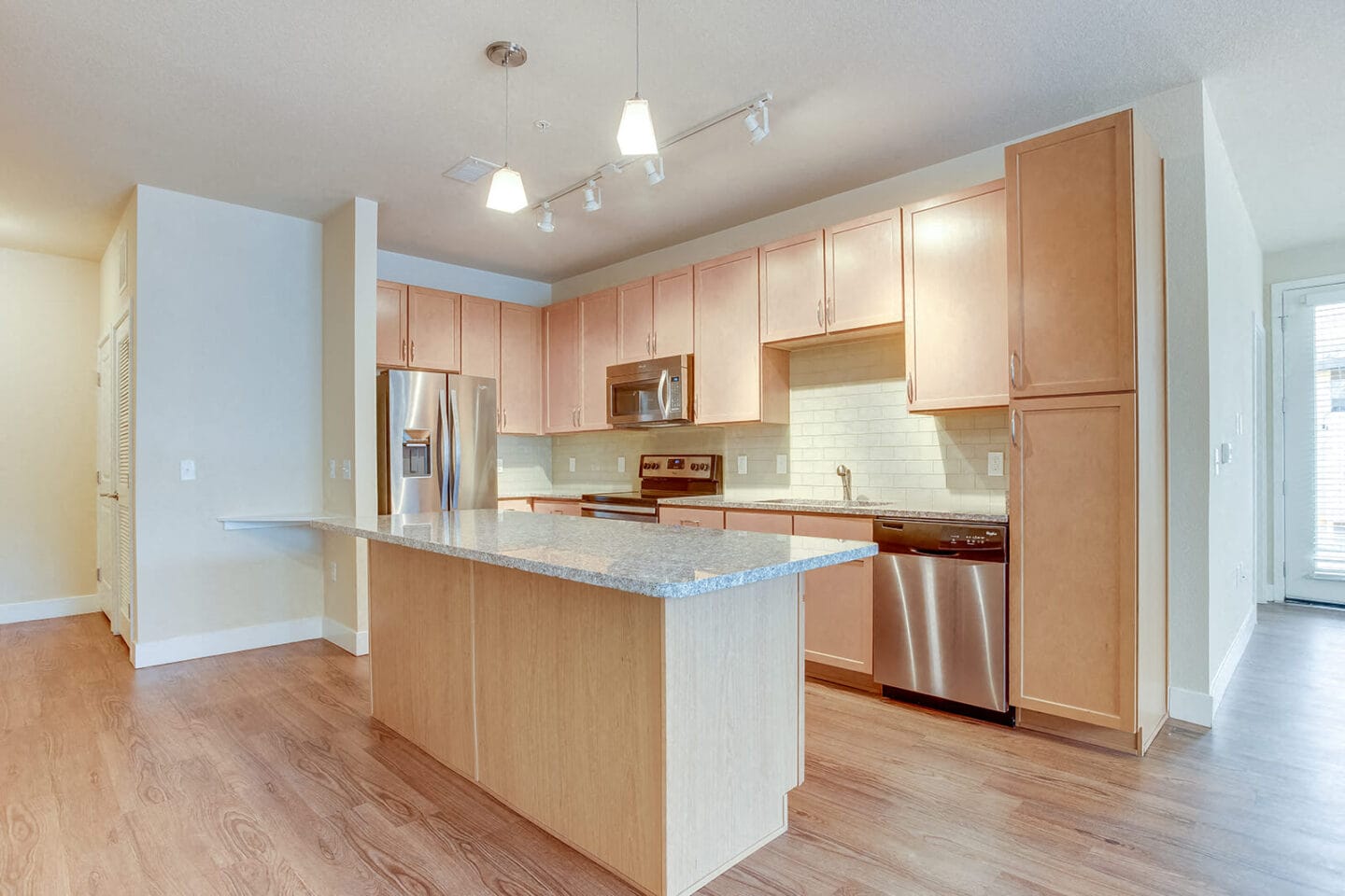 Kitchen Island With Granite Countertops at Element 47 by Windsor, Denver, CO