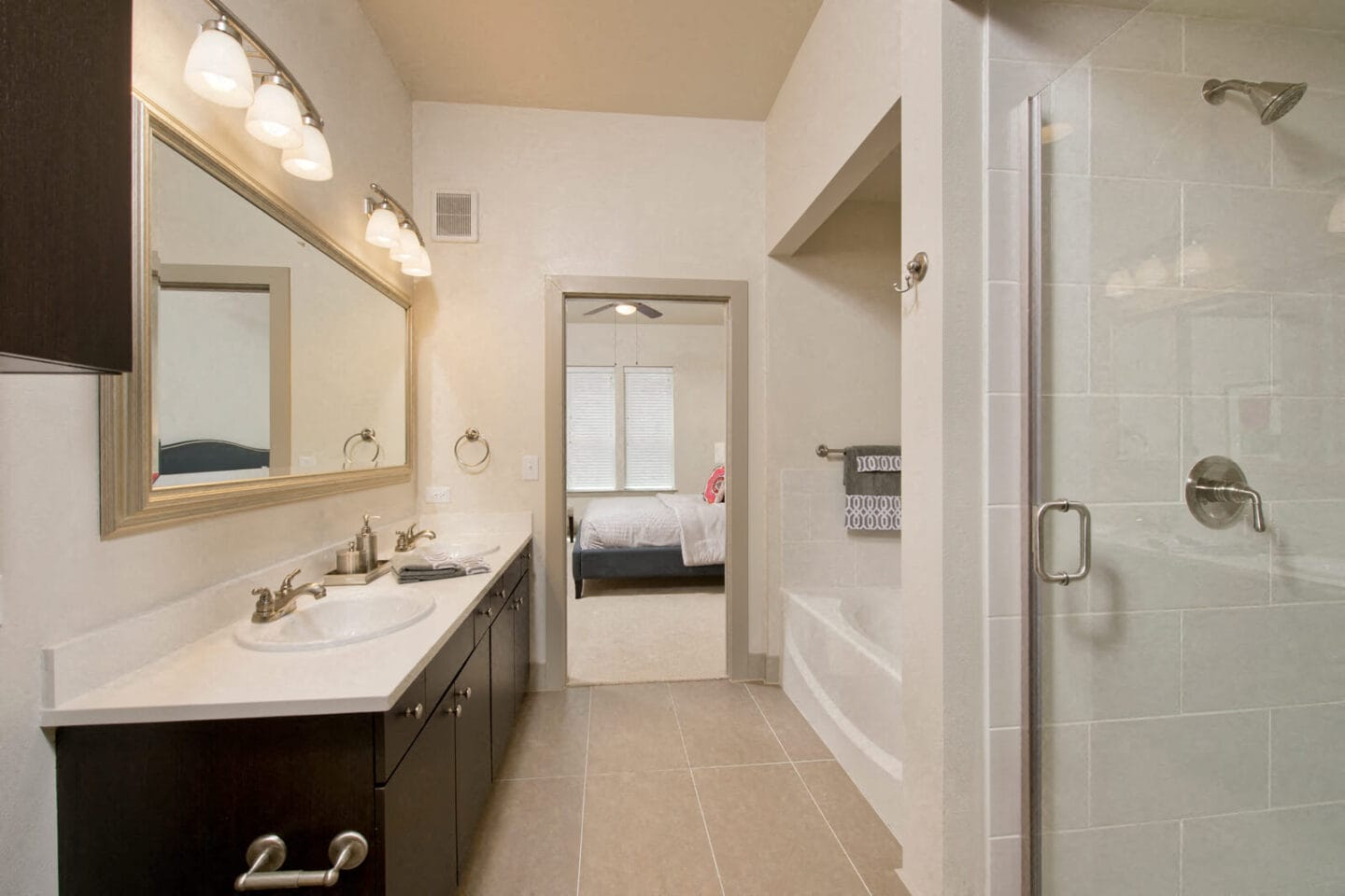 Large Soaking Tub In Bathroom With Tile Surround at Windsor at West University, Houston, 77005