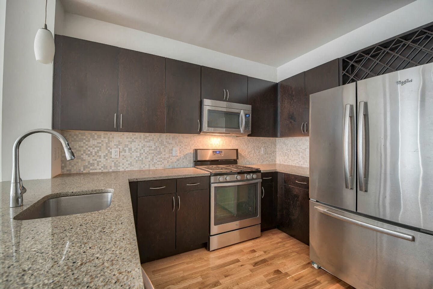 Granite Counters and Mosaic Tiled Backsplashes at Warren at York by Windsor, Jersey City