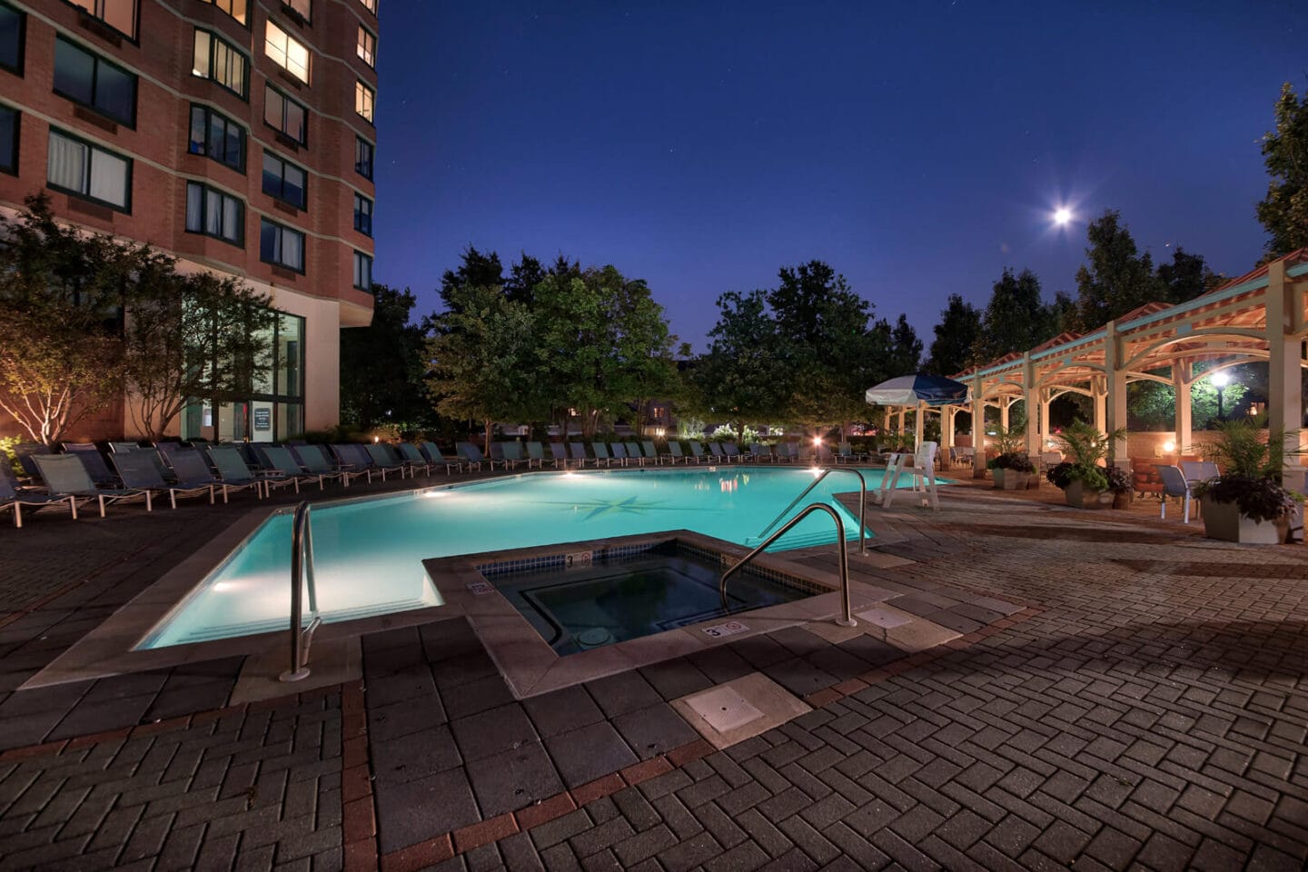 Sparkling Swimming Pool Lights Up at Night at Windsor at Mariners, Edgewater, NJ