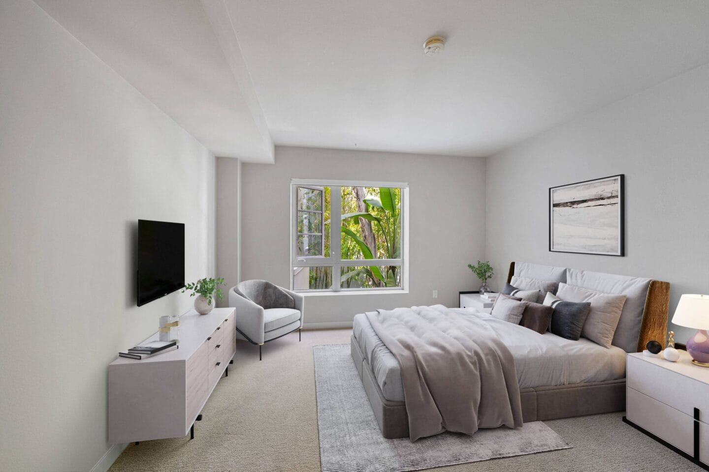 a bedroom with a large bed and a large window