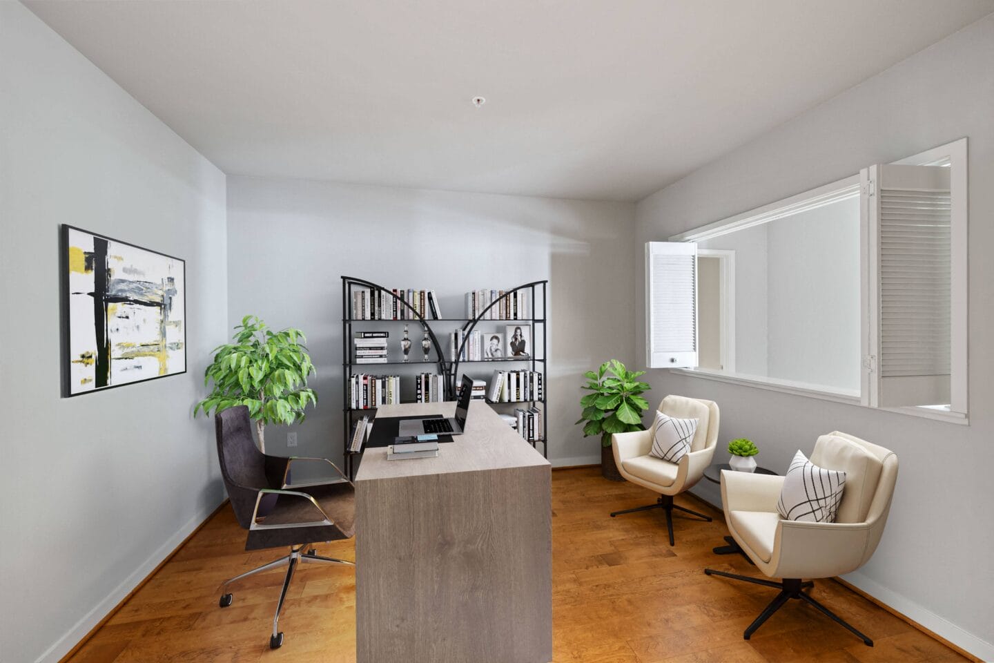 a room with a desk and chairs and a bookshelf in the background