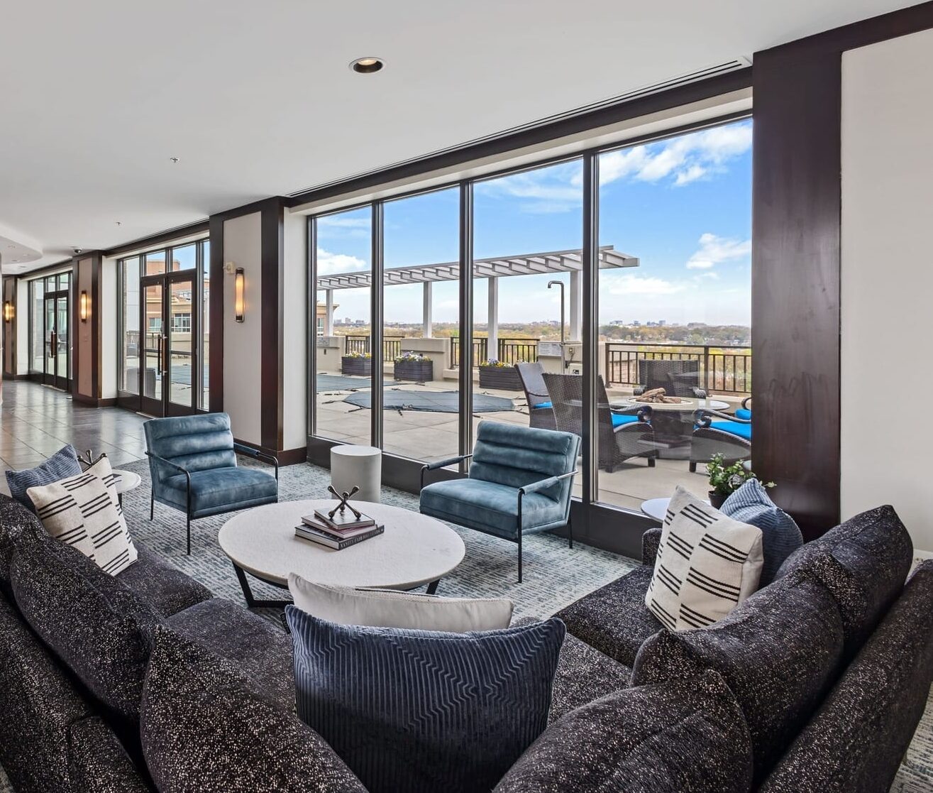 a living room with a couch and chairs and a table