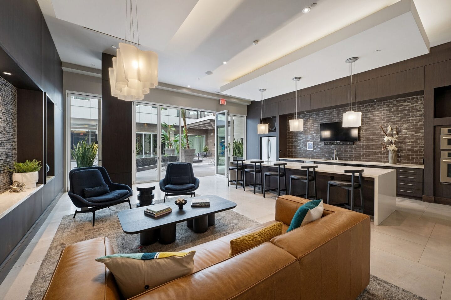 a living room with a couch and a table with chairs