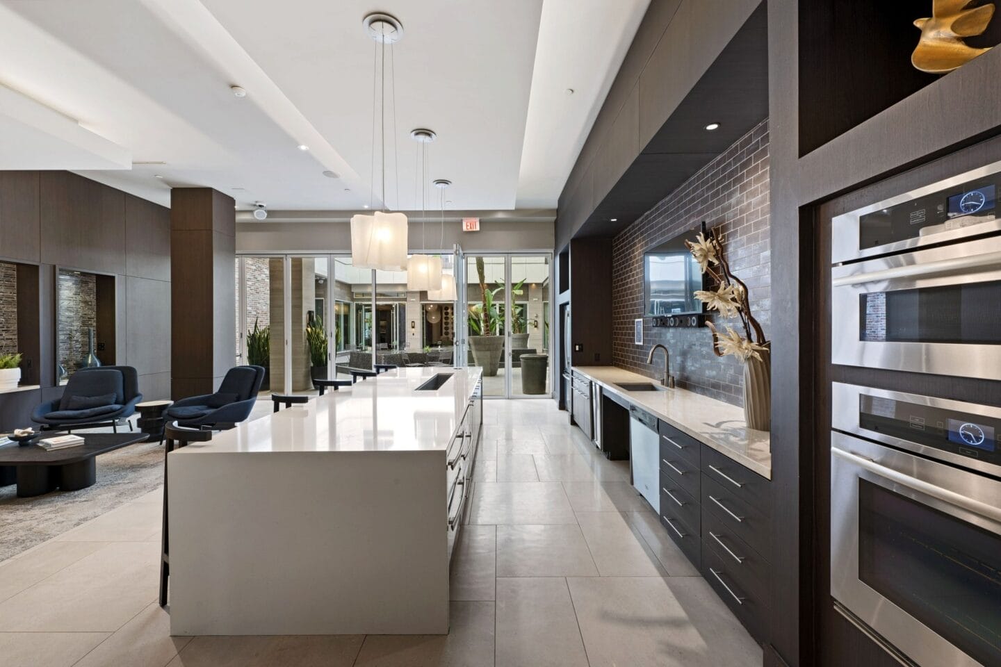 a large kitchen with a large island and a living room