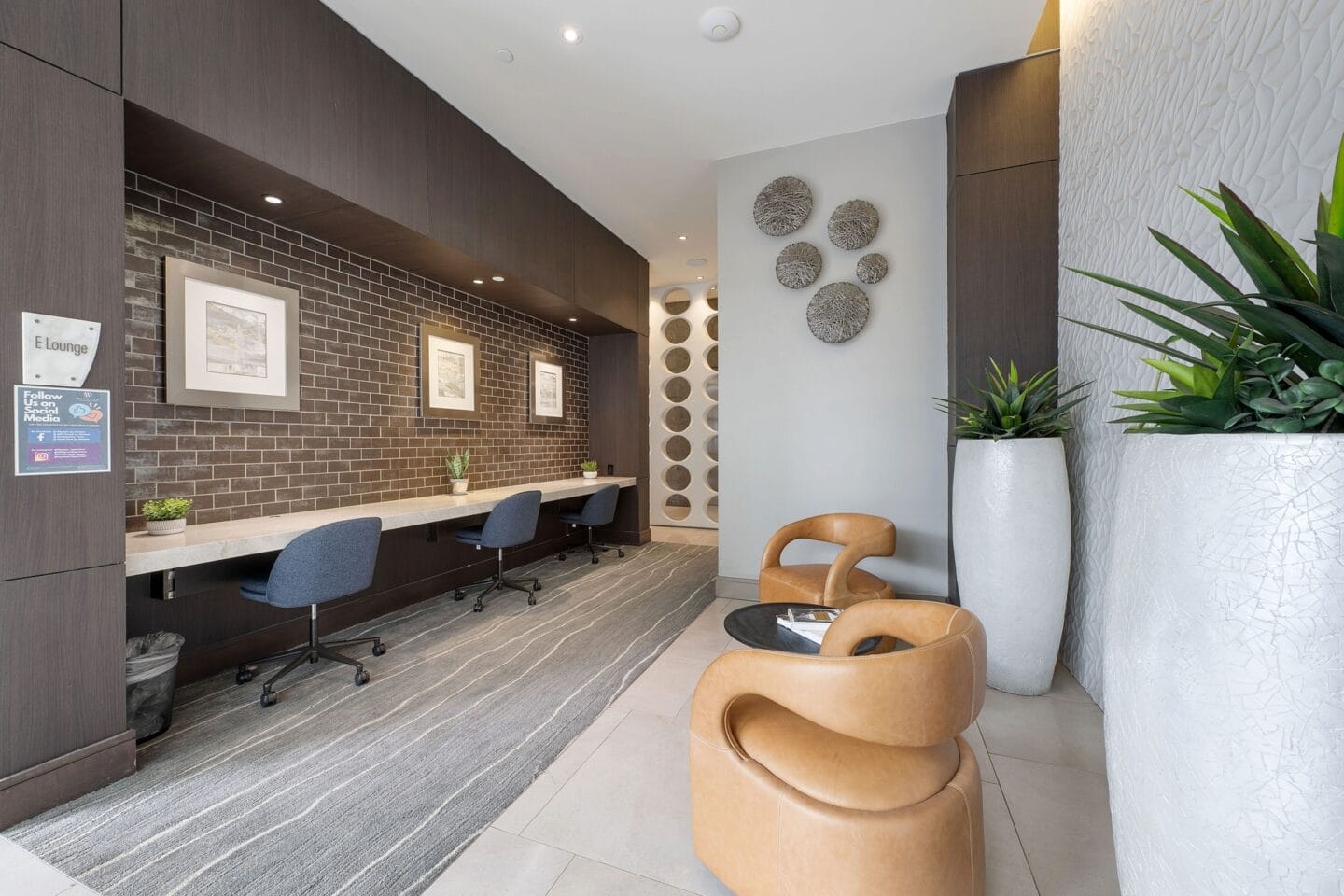 a reception area with a chair and a desk in a lobby