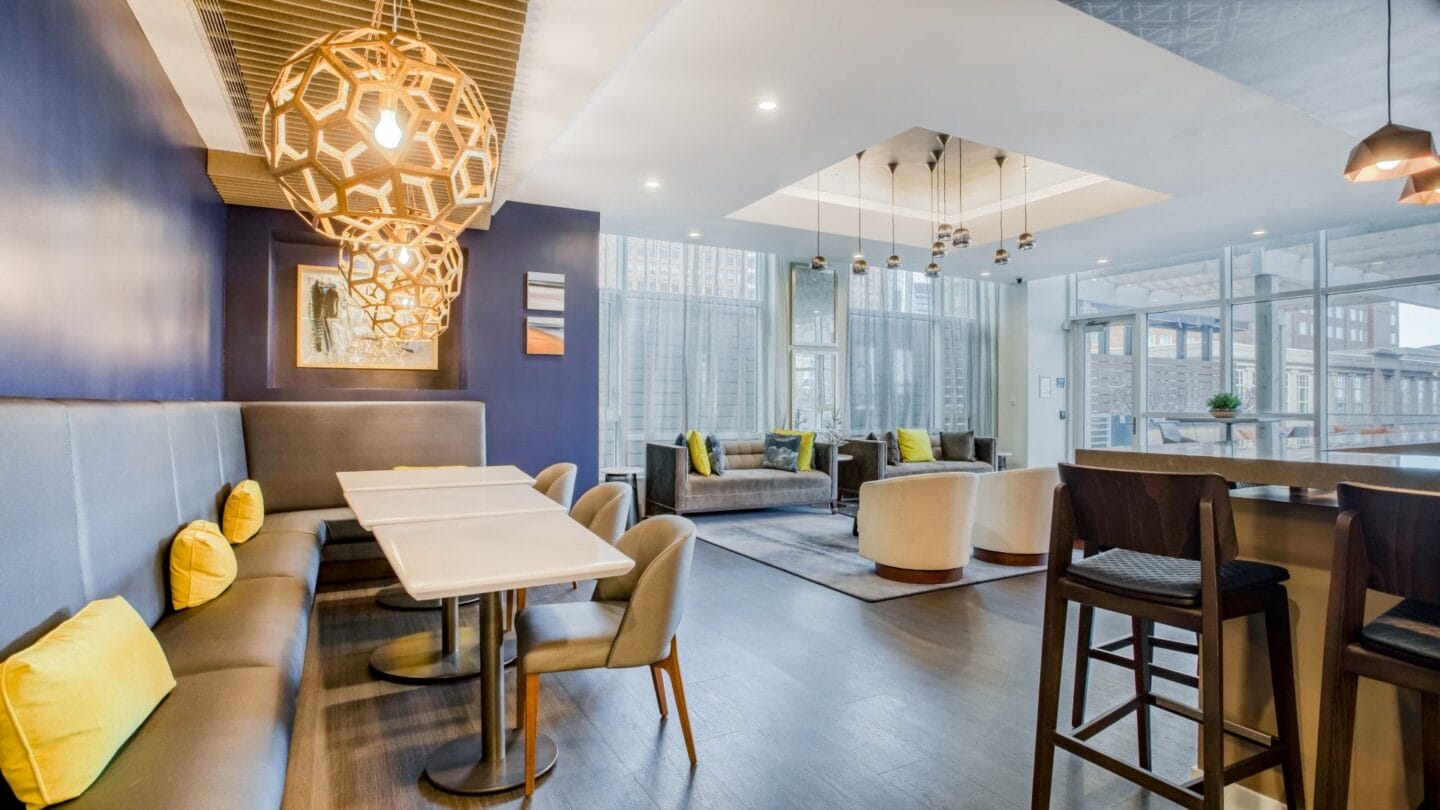 A room with purple walls and a large chandelier hanging from the ceiling