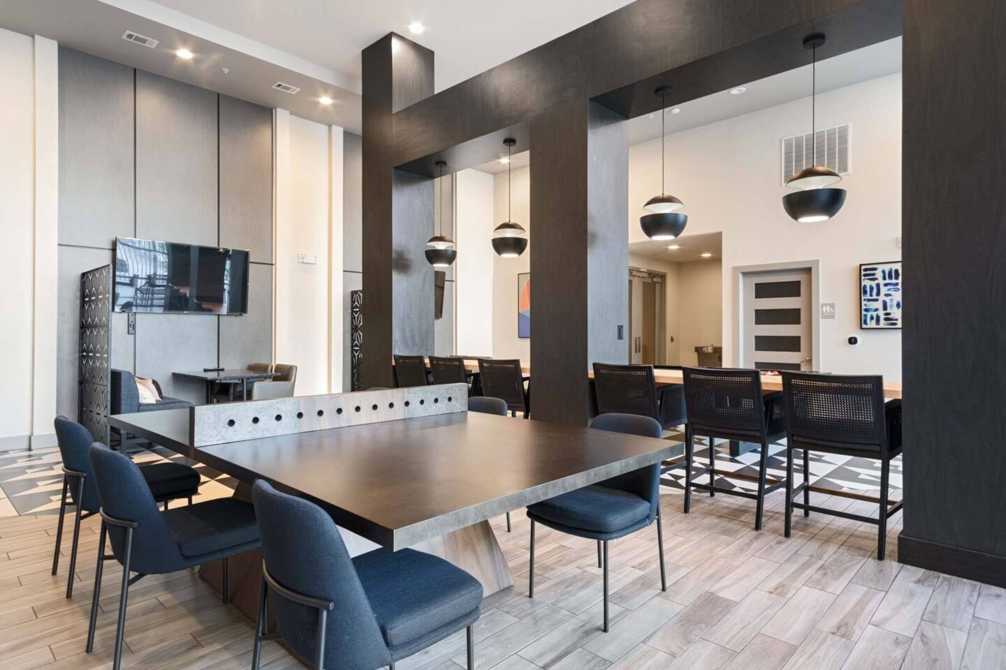 A modern dining room with a large table and chairs at Metro West, Texas, 75024.