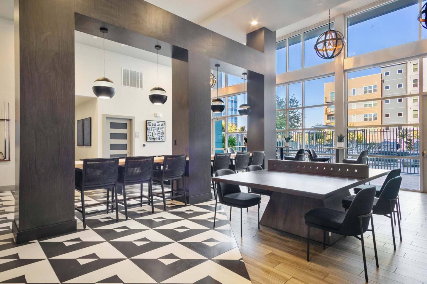 A black and white checkered floor in a modern lounge at Metro West, Texas, 75024.