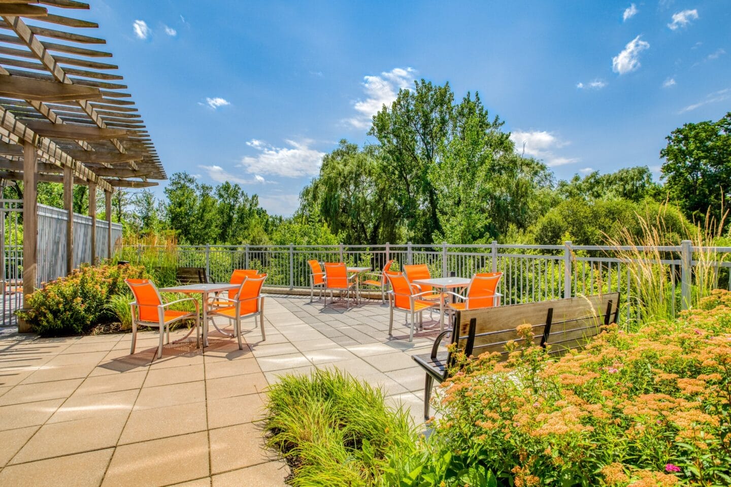 Brightly colored seating chairs and bench on terrace