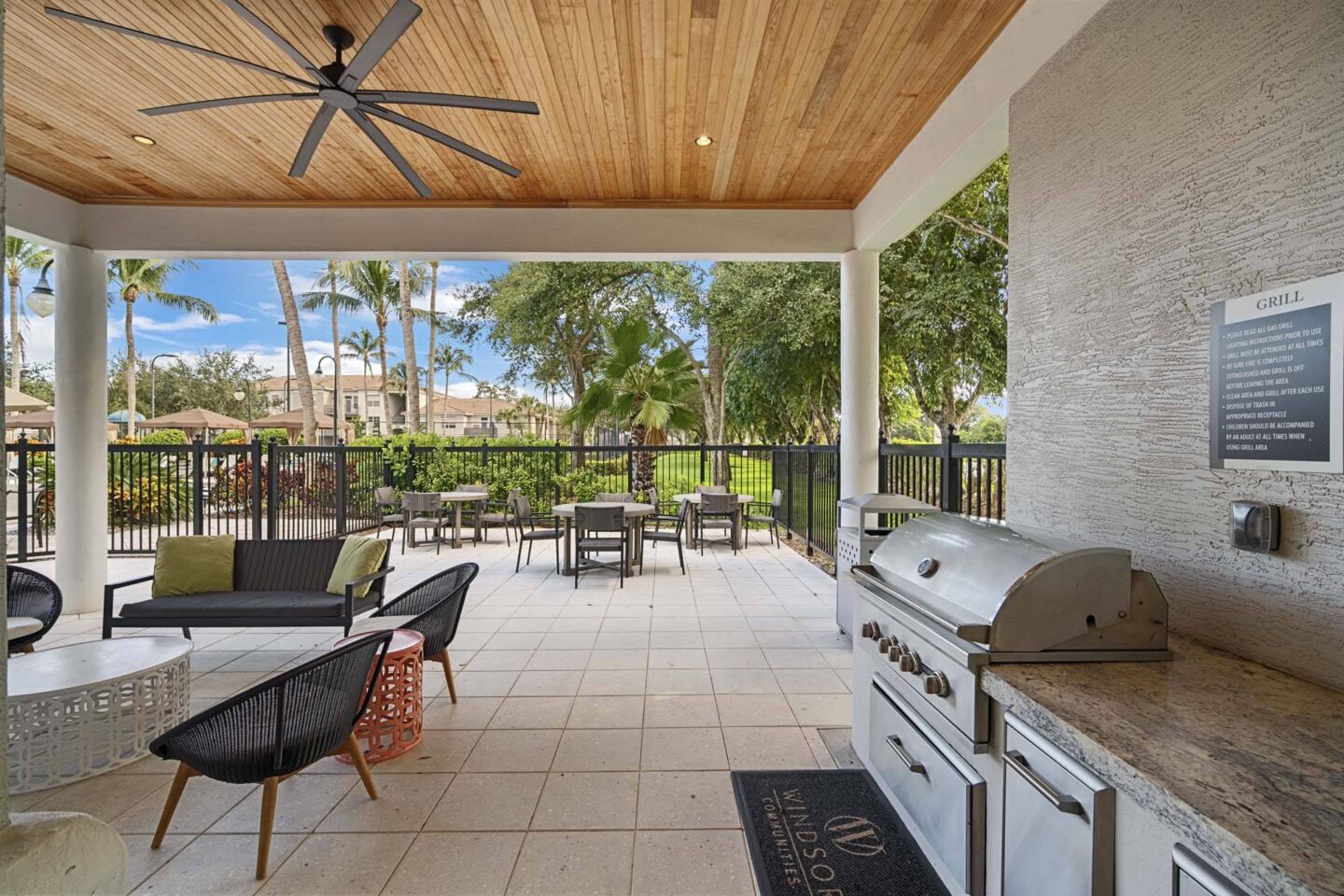 A patio with a grill and chairs at Windsor at Miramar, 3701 SW 160th Ave, Miramar, FL 33027.