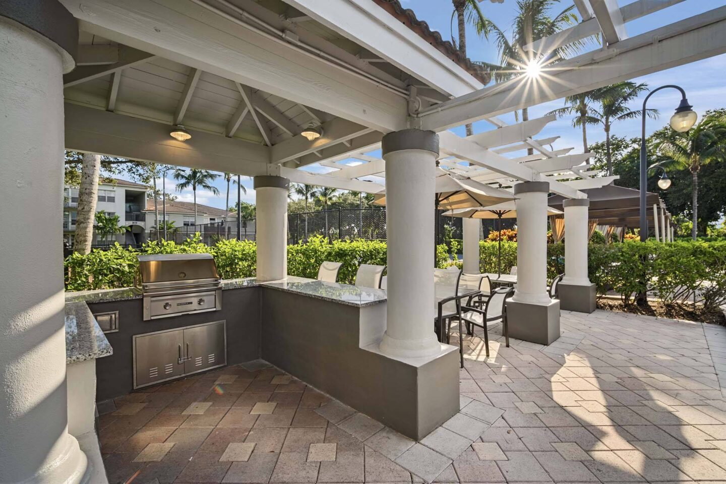 A patio with a grill and pillars at Windsor at Miramar, 3701 SW 160th Ave, Miramar, FL 33027.