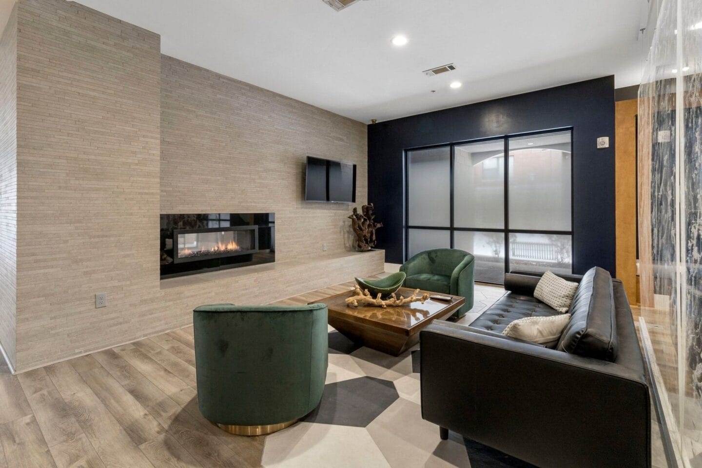 Resident clubhouse lounge featuring fireplace and tv