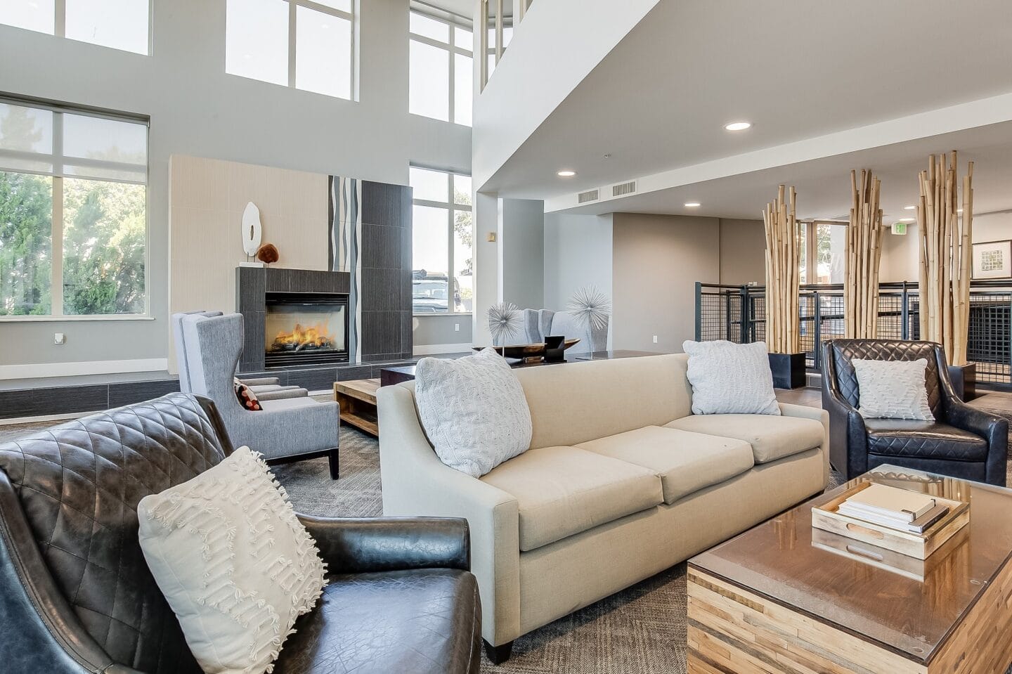 a living room with couches and chairs and a fireplace