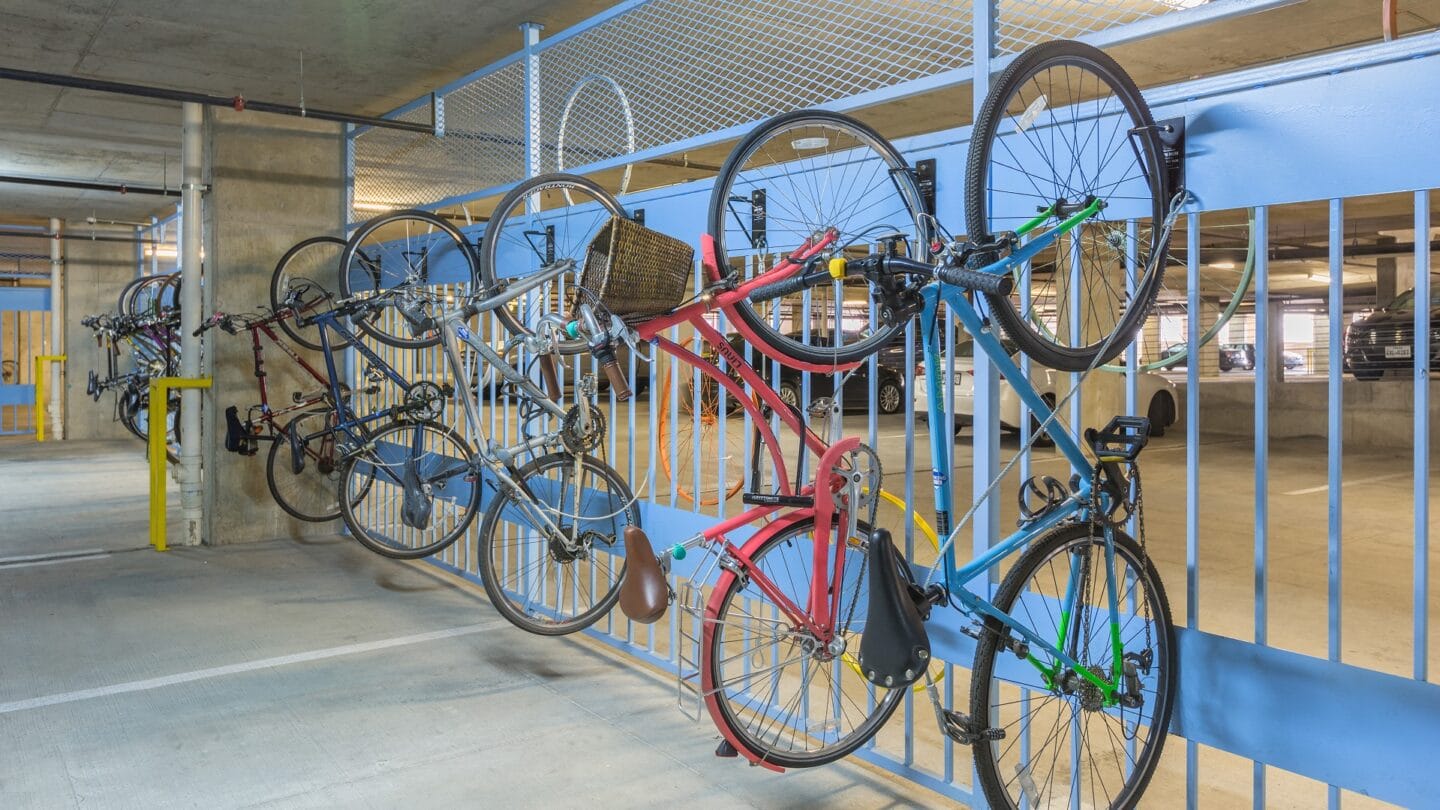 Efficient vertical bike racks offer generous space for bike storage. at Eleven by Windsor, Austin