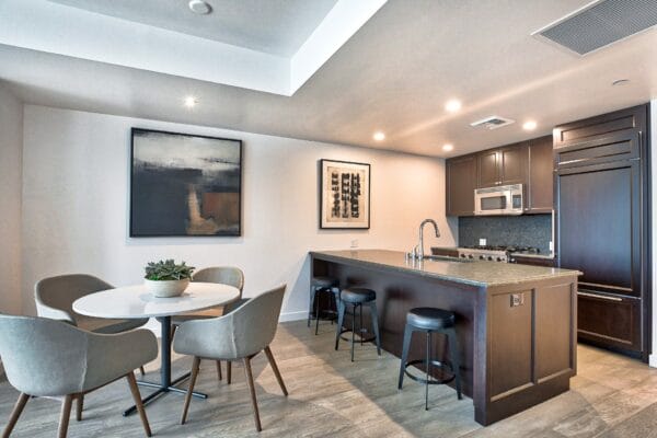 Kitchen with Granite Countertops and Espresso Cabinetry at The Bravern, 688 110th Ave NE, Bellevue