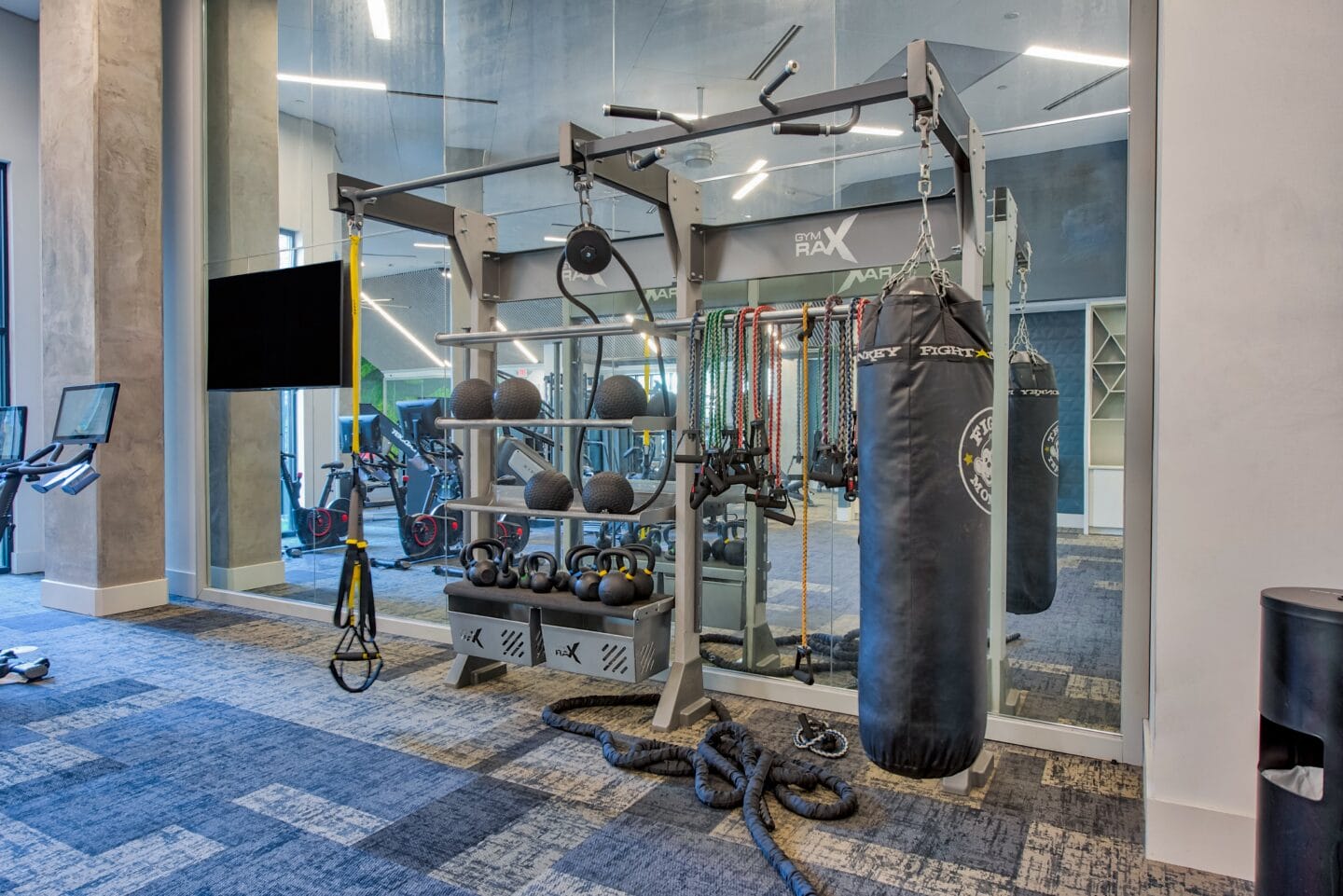 a boxing bag and other equipment in the fitness center