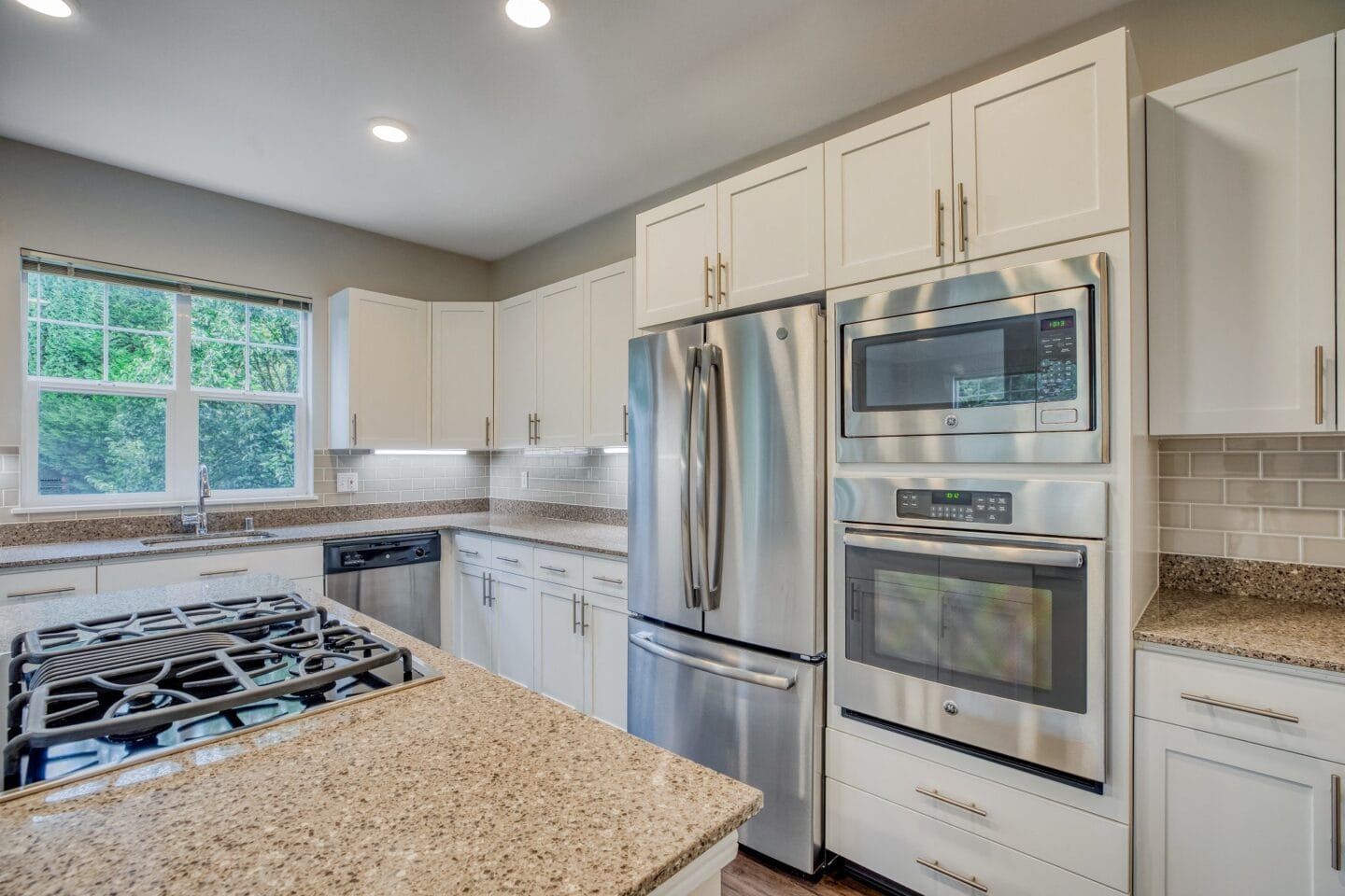 Modern kitchens with granite counter-tops and tile back-splash at The Estates at Cougar Mountain, Issaquah, Washington