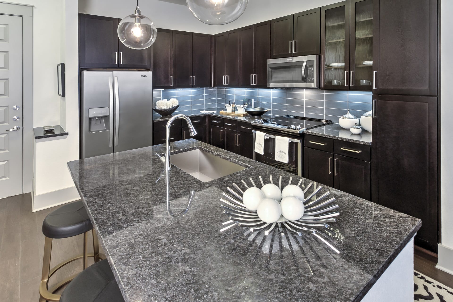 Kitchen island with breakfast bar at Windsor Fitzhugh, 4926 Mission Avenue, Dallas