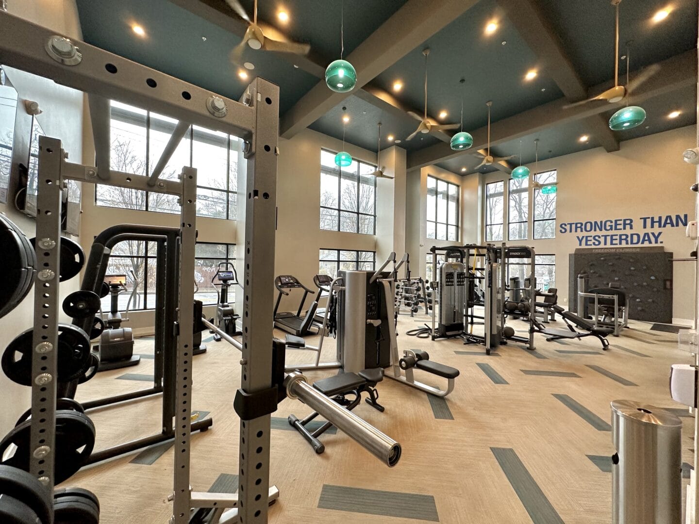 A spacious fitness center with cardio equipment and windows at Windsor Old Fourth Ward, Atlanta, GA