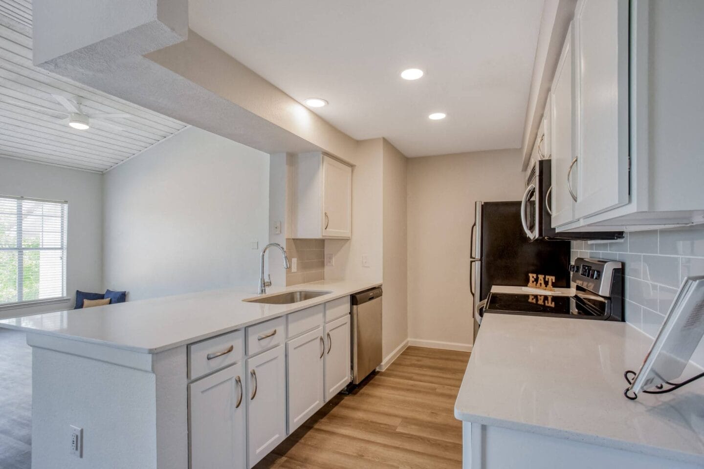 Modern kitchen, white quartz, stainless steel appliances