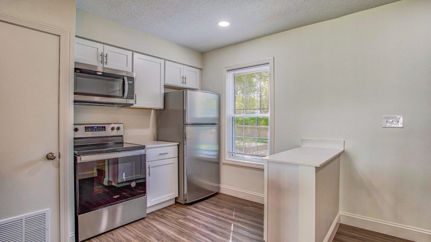 A kitchen with white cabinets and stainless steel appliances at Windsor Ridge at Westborough, 1 Windsor Ridge Drive, Westborough