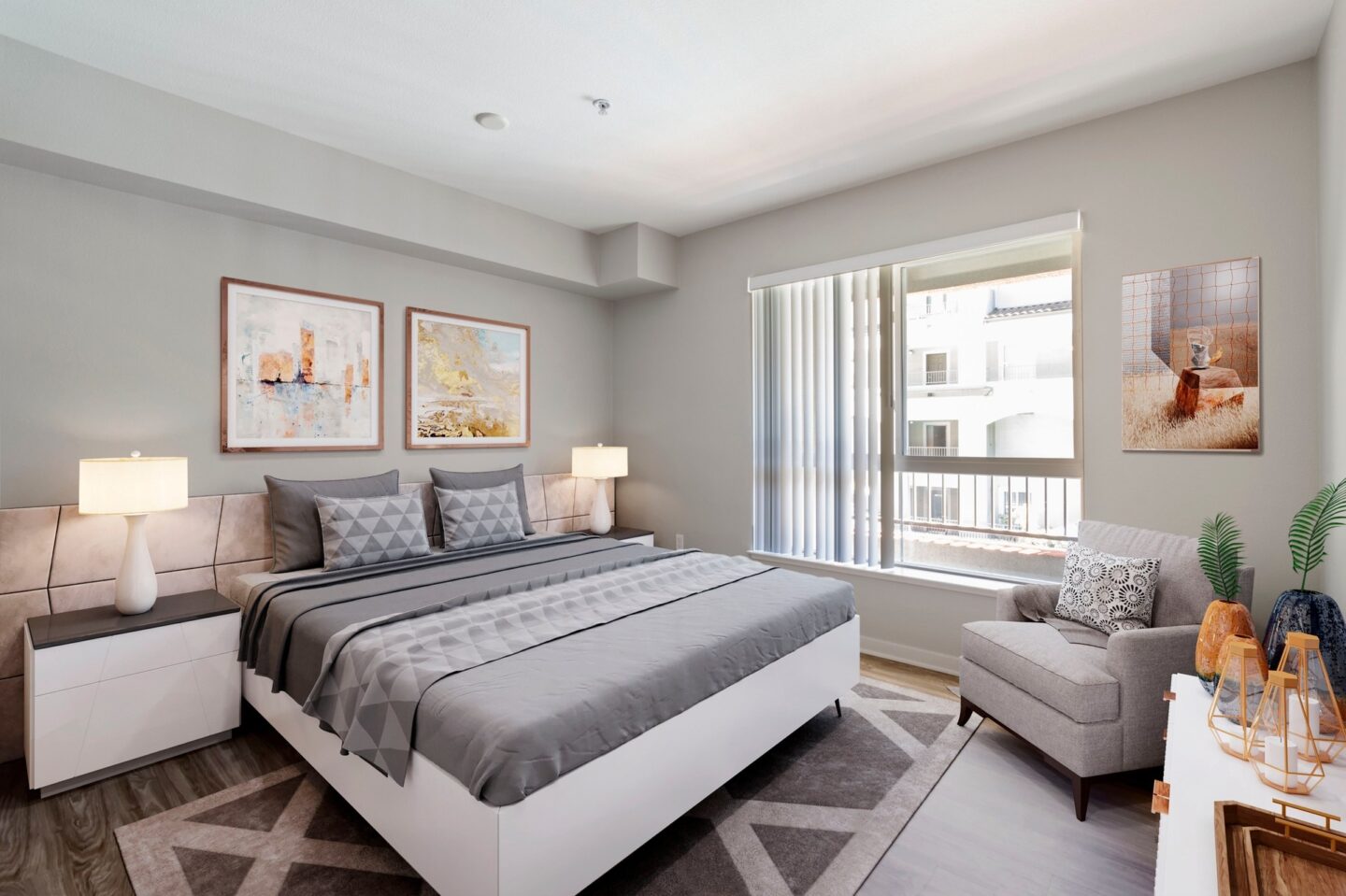 A bedroom with a large bed and a window with curtains.