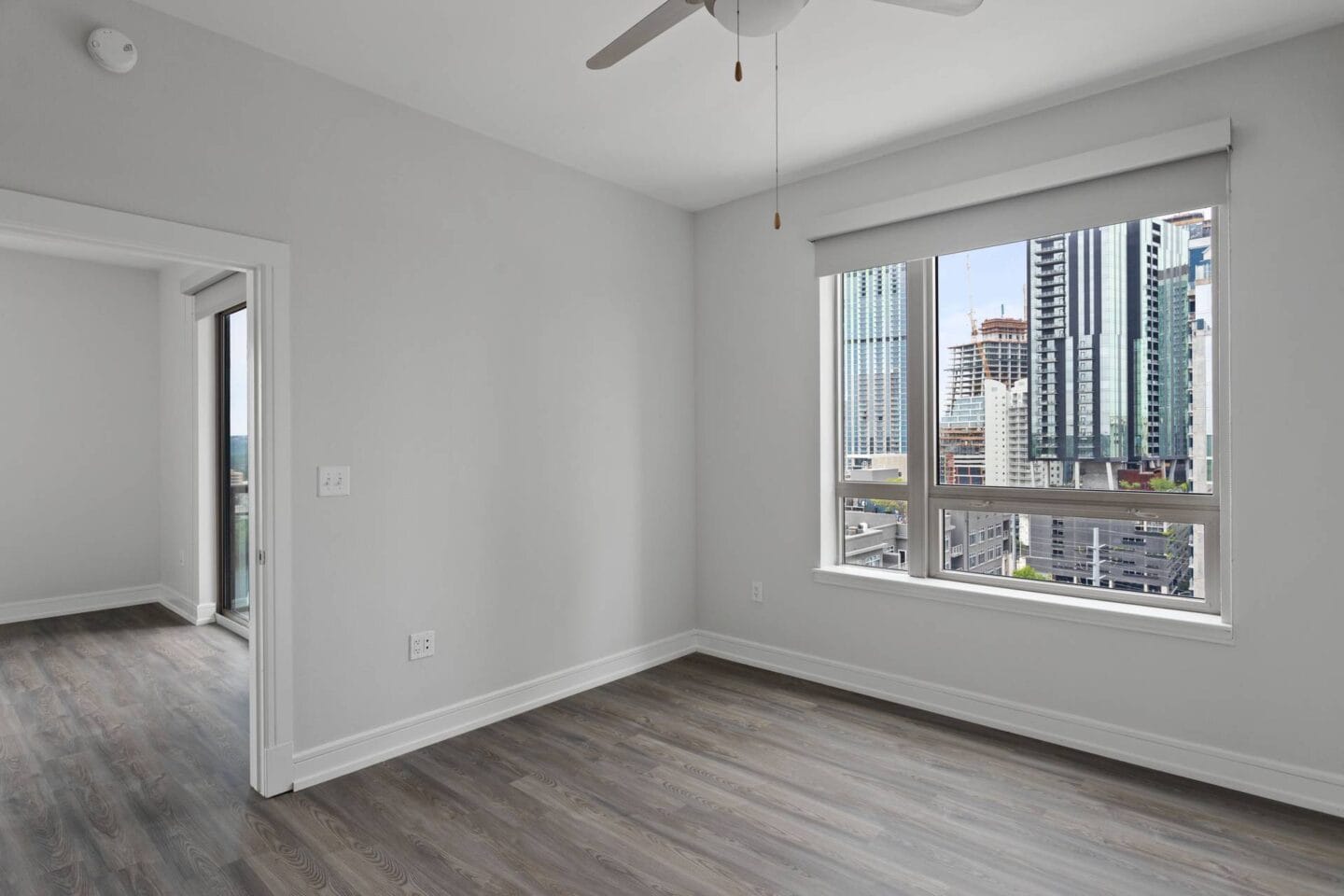 Bedroom with large window at Windsor on the Lake, 43 Rainey Street Austin, TX 78701