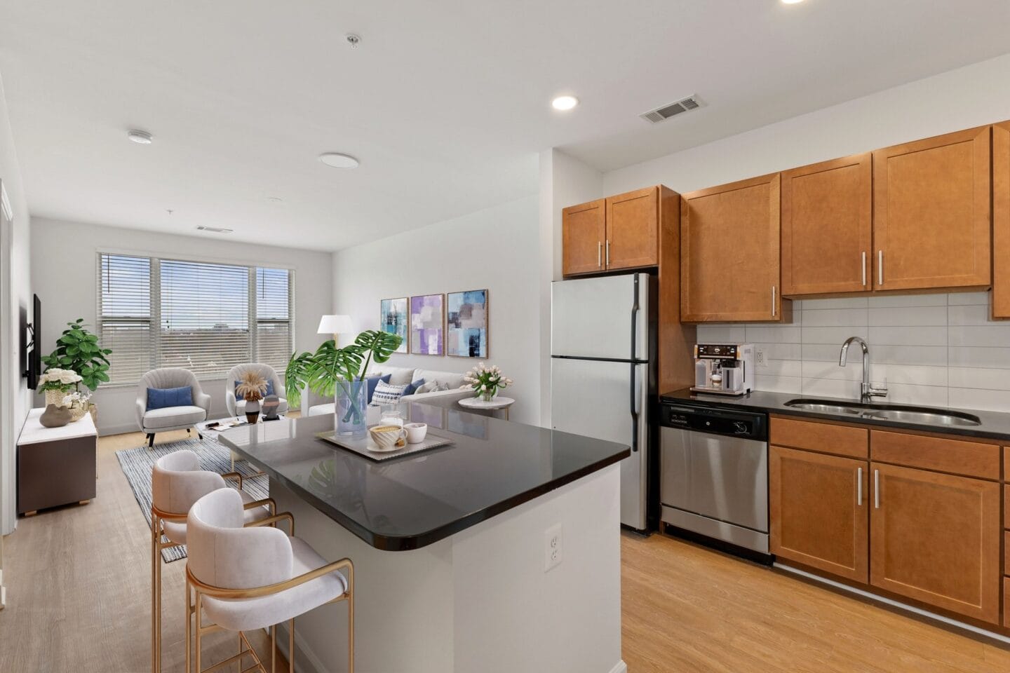 a kitchen and living room with a table and chairs