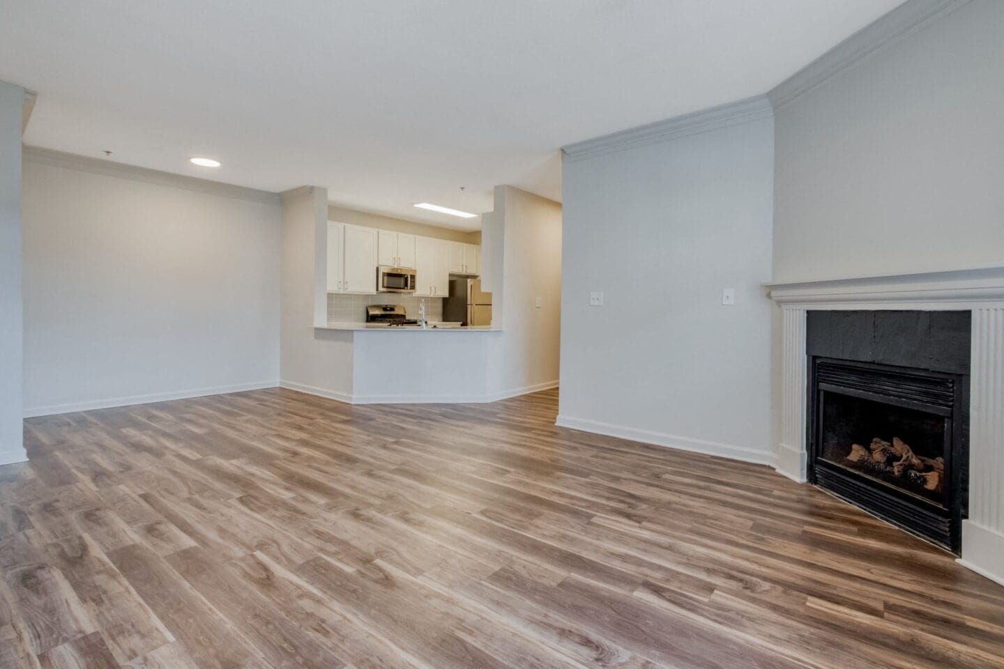 Living room with fireplace at Windsor Herndon, Virginia, 20171