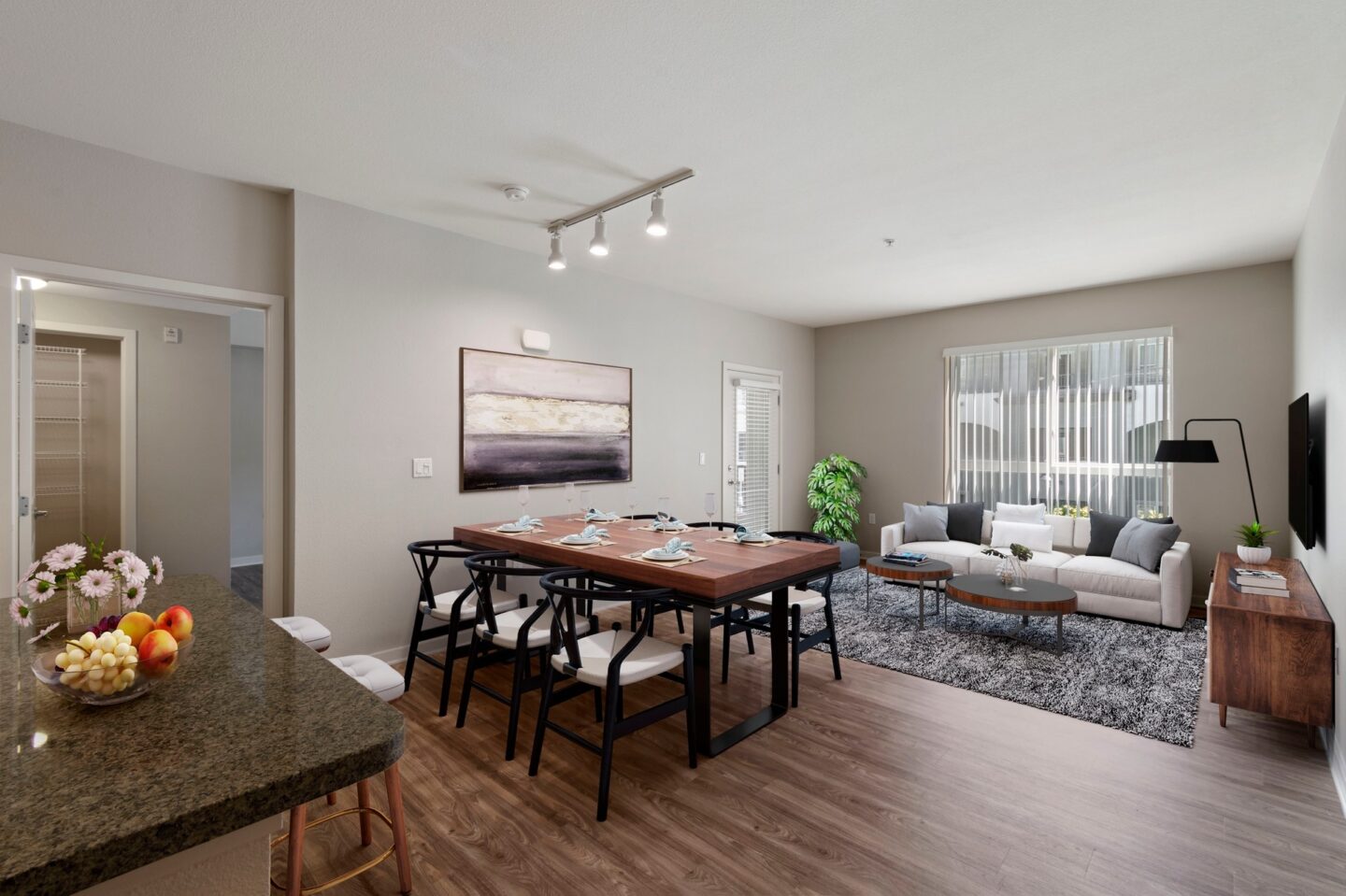 A modern living room with a dining table and a couch.