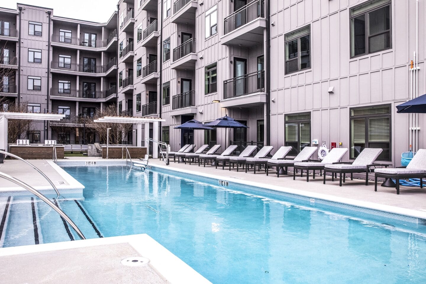 Lounge chairs near pool at Windsor Interlock, 2 Interlock Ave NW, Atlanta