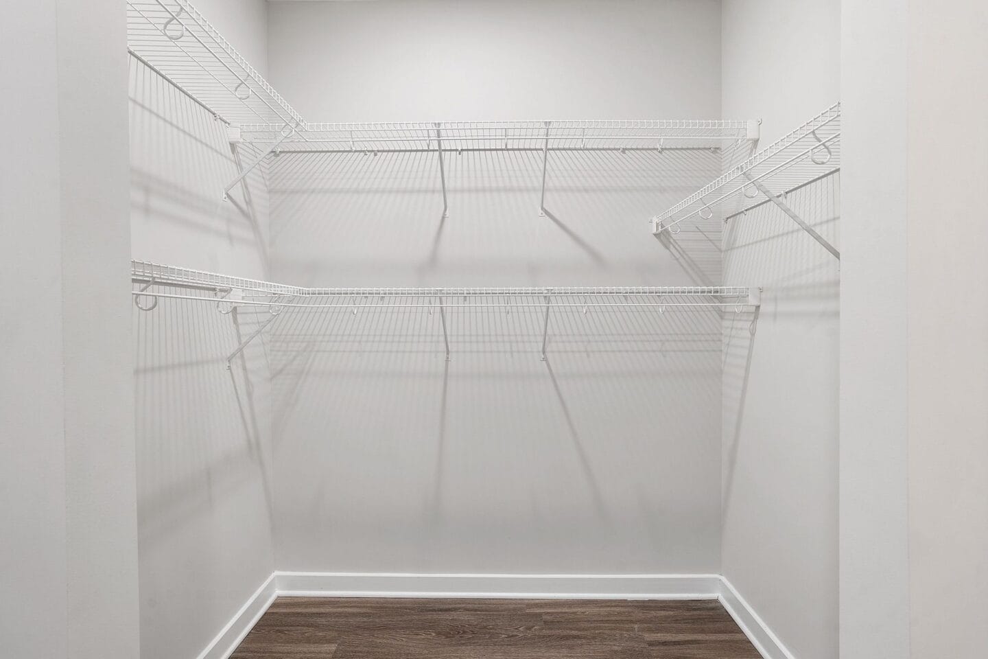 Spacious closets with shelving, perfect for organizing shoes and clothes.