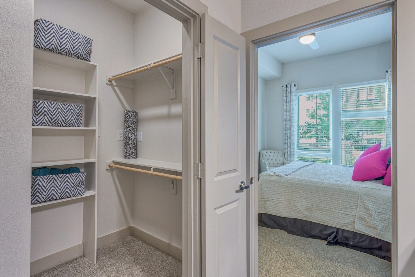 Walk-in closets with custom shelving at Metro West, Plano, TX