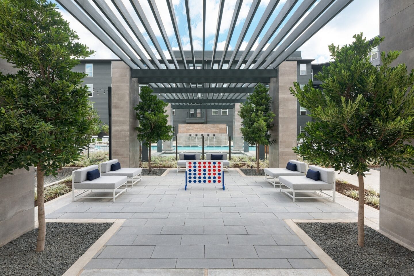 Relax with friends at our pool courtyard with lounge seating at Windsor South Congress, Austin, TX