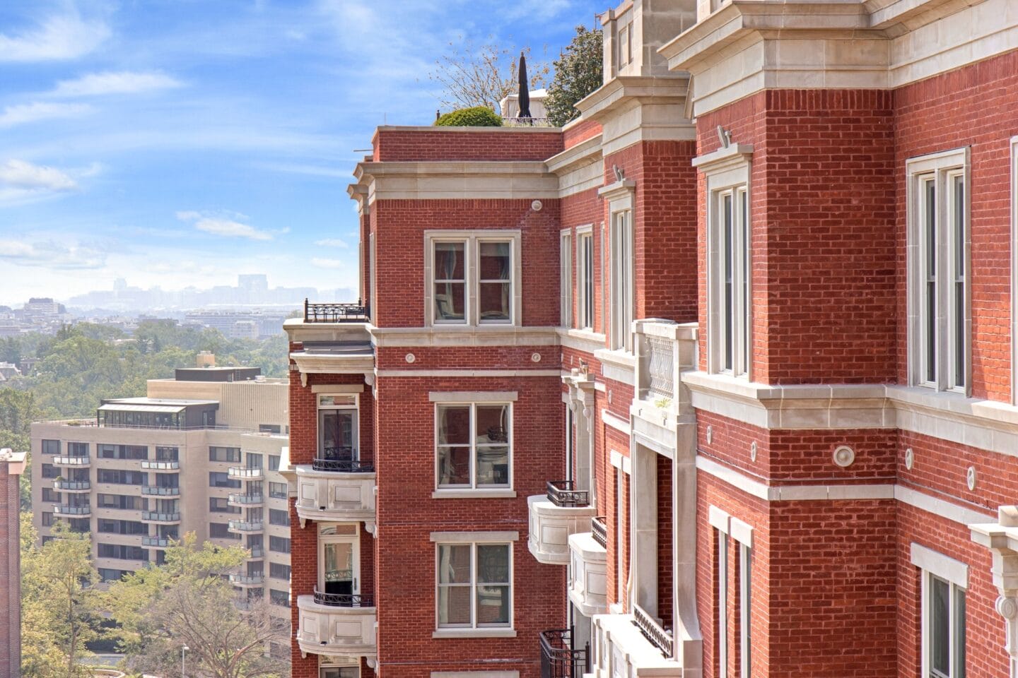 a red brick building with a city in the background