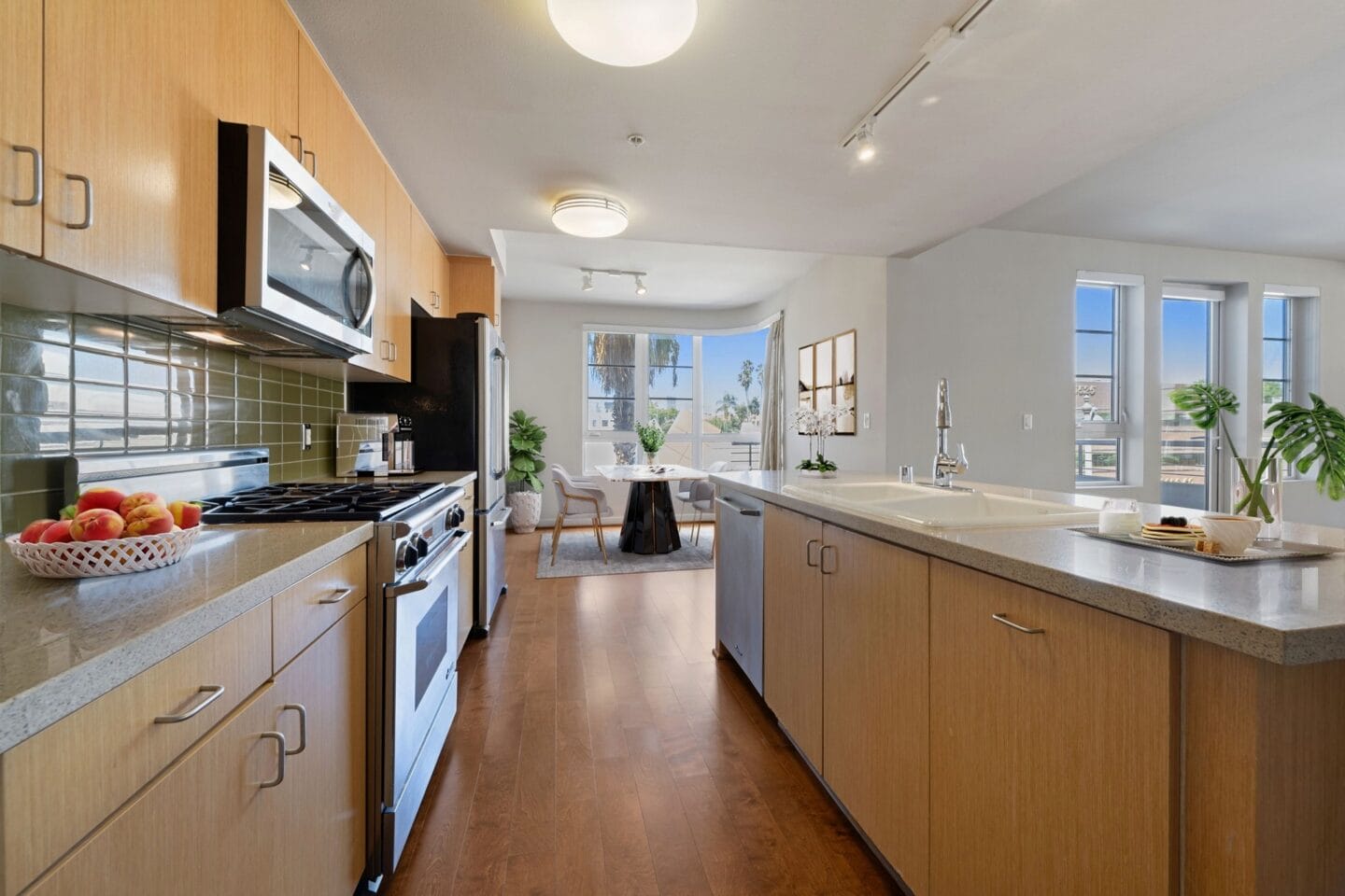 a kitchen with wooden cabinets and stainless steel appliances and a counter top