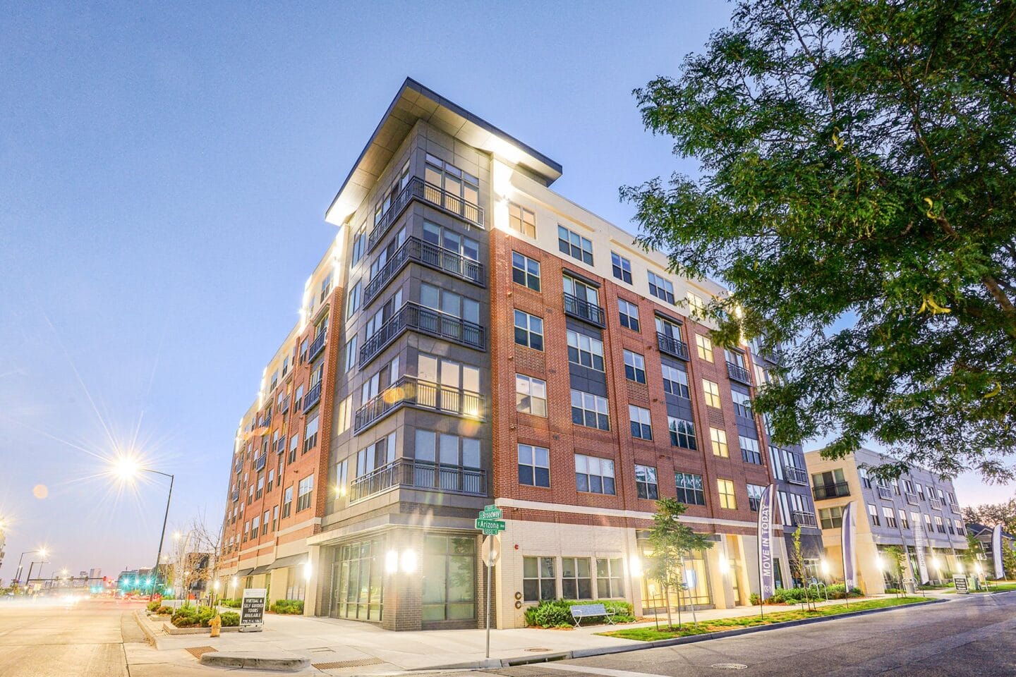 View of building from street at twilight at Platt Park by Windsor, 99 E Arizona Ave, Denver