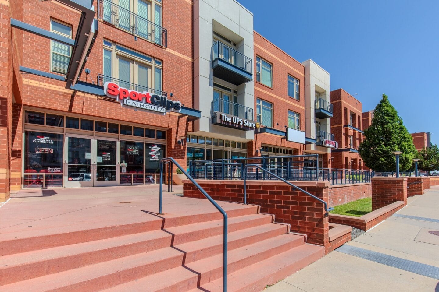 a large brick building with stairs in front of it