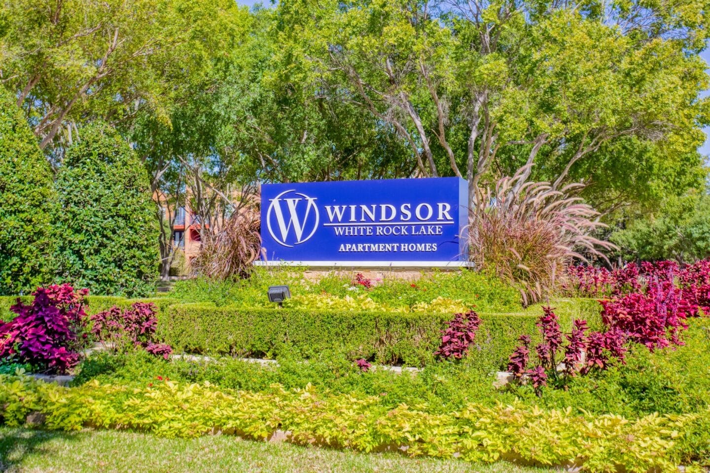 Blue Property Sign with Landscaping at Windsor on White Rock Lake