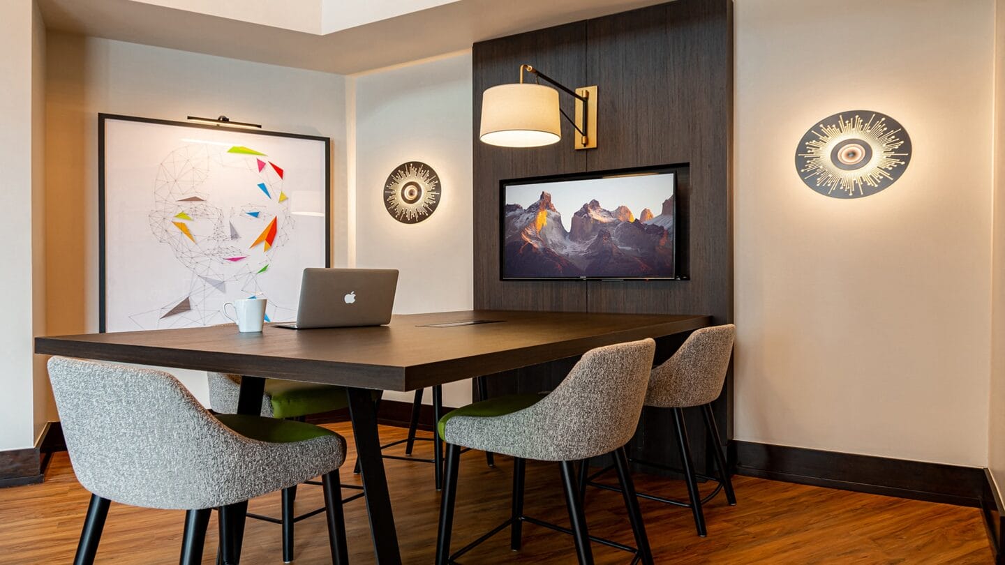 Conference table and TV at The Ridgewood by Windsor, Fairfax, Virginia