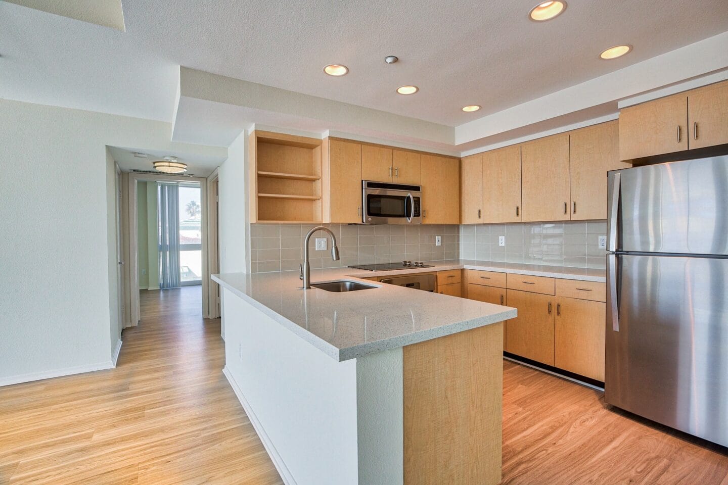 Modern kitchen with breakfast bar at Sea Castle, Santa Monica