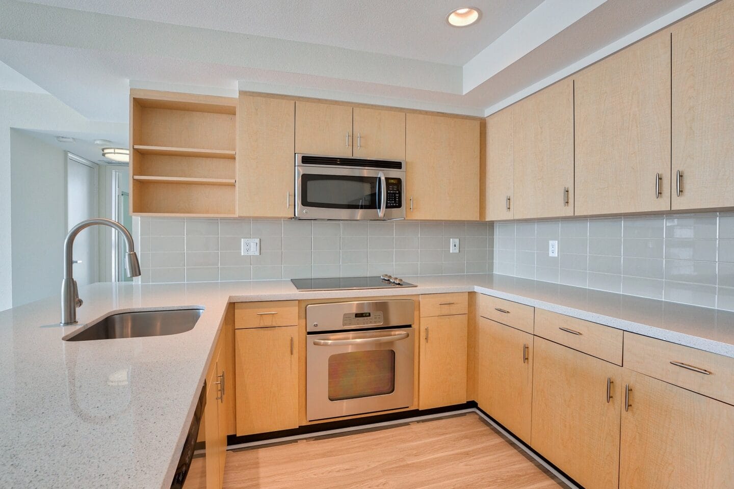 Modern kitchen with stainless steel appliances at Sea Castle, Santa Monica